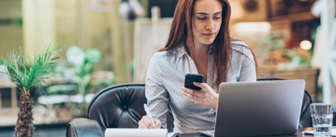 Young businesswoman working in the lobby of a modern business building