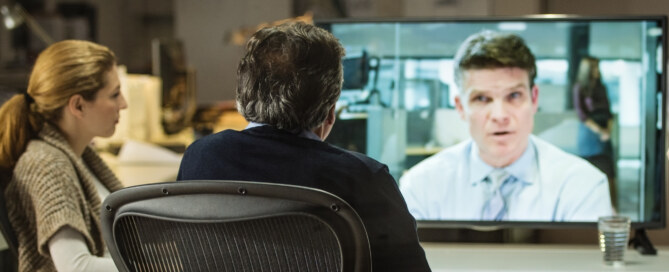 Architects and project manager in a video conference meeting with client