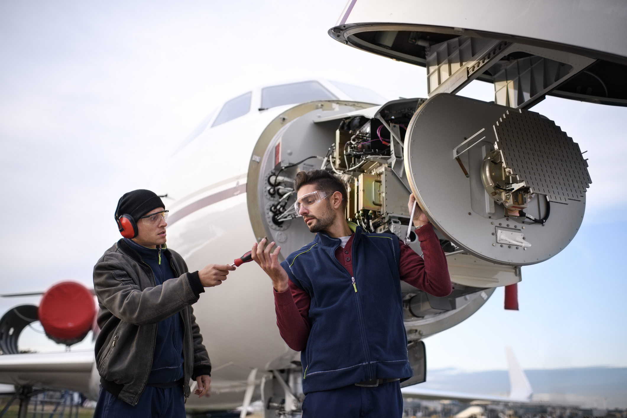 Aircraft mechanics service a small plane